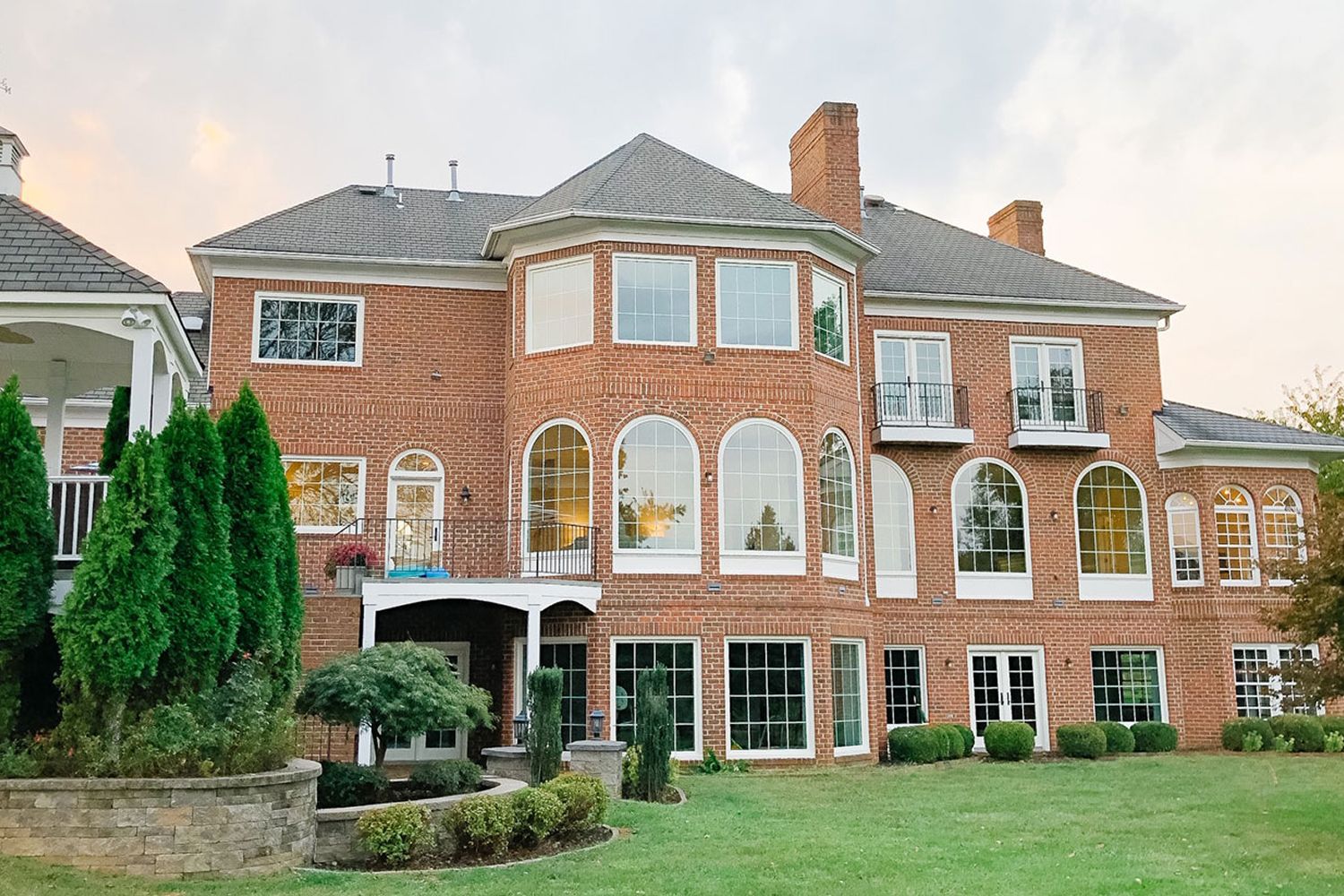 Rear exterior view of the Kaplar house, It's all brick and the windows look new and beautiful.