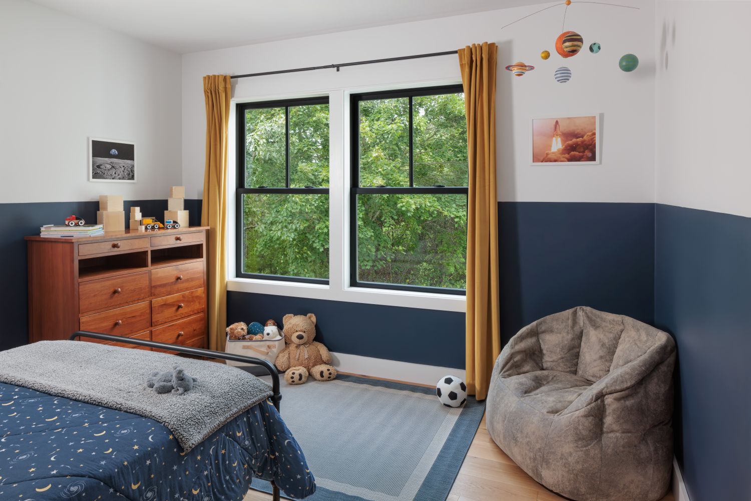 Custom Black Renewal by Andersen Windows in a child's bedroom. 