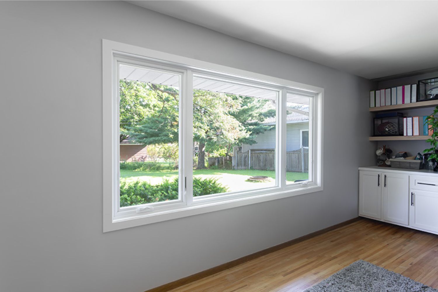 A tidy room featuring a window and a desk, creating a bright and organized workspace.