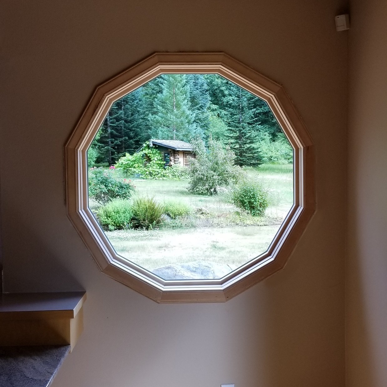 A specialty window in a circle shape that has 12 sides