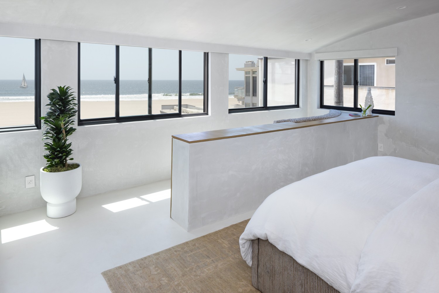 The primary suite in Breegan Jane's california beach house.