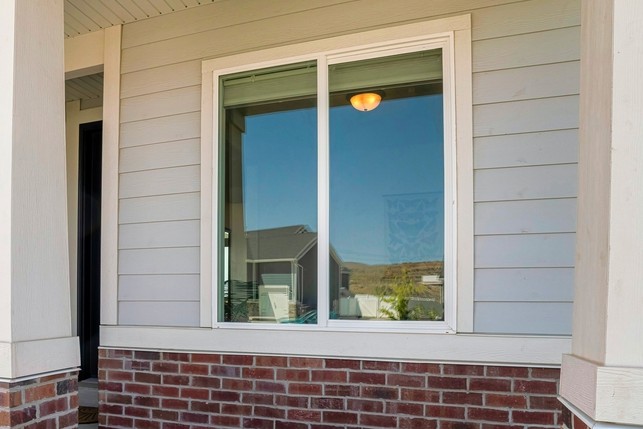 A window made with vinyl. Vinyl may bend, bow, or crack. it is often the most economic alternative. It is ow-maintenance, but can have a shorter lifespan.