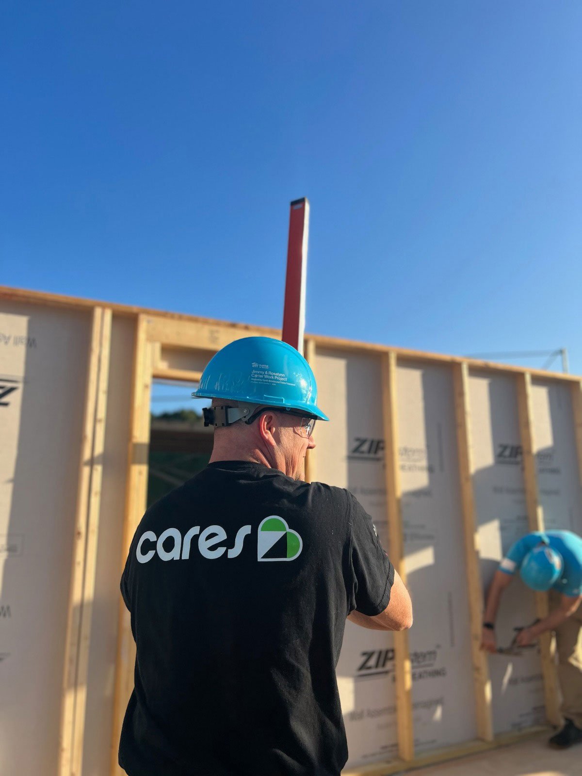 Renewal by Andersen volunteers work on Habitat for Humanity Carter Project